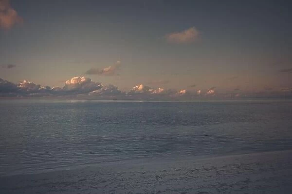 Beautiful sunset seascape with cloud on a tranquil day