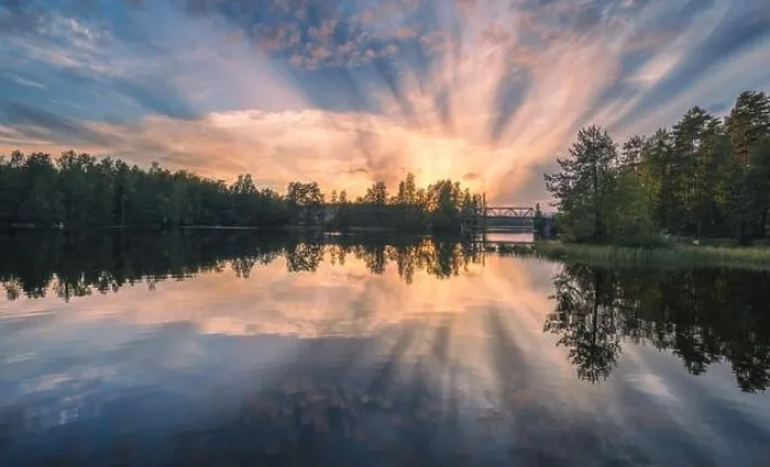 Framed Print : Beautiful sunset in tranquil lake at summer evening in Finland Framed Print : Beautiful sunset in tranquil lake at summer evening in Finland