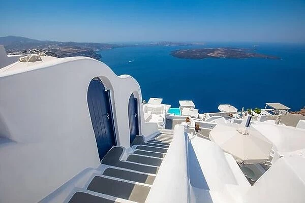 Beautiful travel background for vacation holiday banner. White houses in the town of Oia on the island of Santorini, panorama. Amazing scenic views