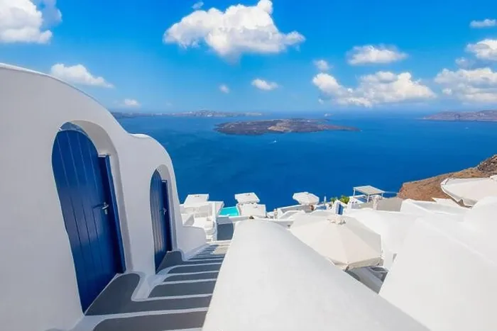 Framed Print : Beautiful travel background for vacation holiday banner. White houses in the town of Oia on the island of Santorini, panorama. Amazing scenic views Framed Print : Beautiful travel background for vacation holiday banner. White houses in the town of Oia on the island of Santorini, panorama. Amazing scenic views