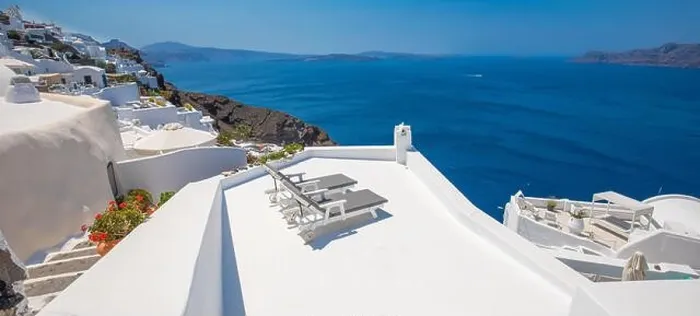 Framed Print : Beautiful travel background for vacation holiday banner. White houses in the town of Oia on the island of Santorini, panorama. Amazing scenic views Framed Print : Beautiful travel background for vacation holiday banner. White houses in the town of Oia on the island of Santorini, panorama. Amazing scenic views