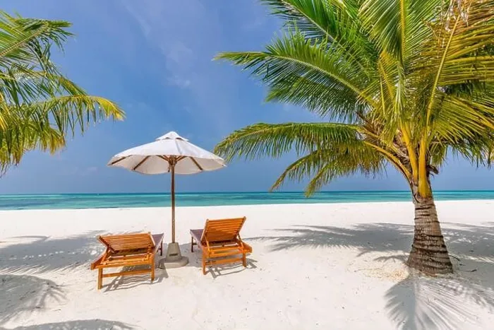 Framed Print : Beautiful tropical beach, two sun beds, loungers, umbrella under palm tree. White sand, sea view horizon, blue sky, calmness and relax resort scenery Framed Print : Beautiful tropical beach, two sun beds, loungers, umbrella under palm tree. White sand, sea view horizon, blue sky, calmness and relax resort scenery