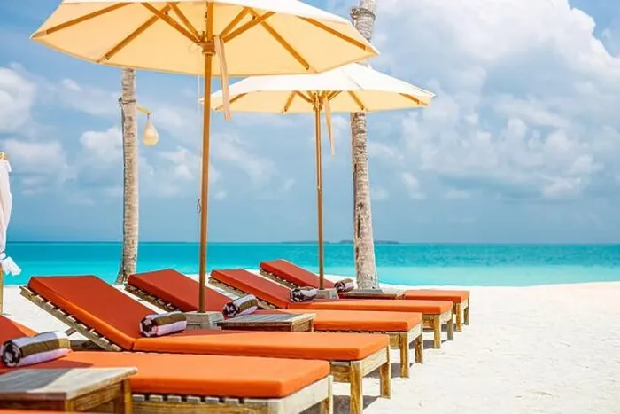 Framed Print : Beautiful tropical island scenery, two sun beds, loungers, umbrella. White sand, sea view with horizon, idyllic blue sky, calmness and relaxation Framed Print : Beautiful tropical island scenery, two sun beds, loungers, umbrella. White sand, sea view with horizon, idyllic blue sky, calmness and relaxation