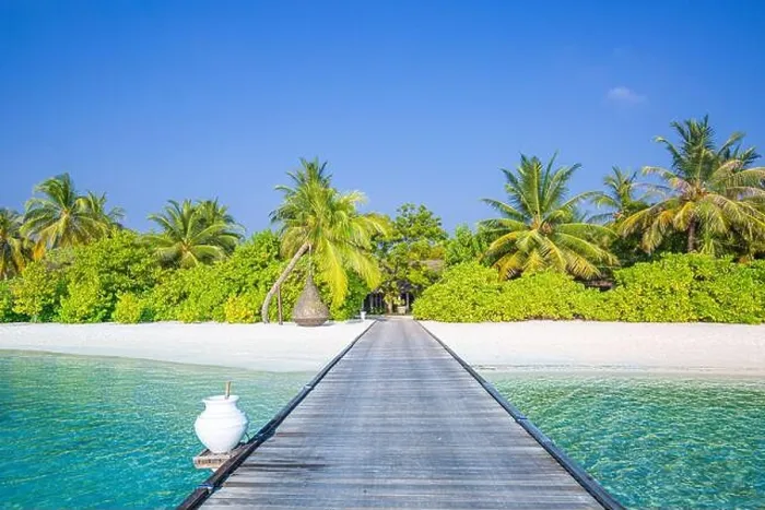 Framed Print : Beautiful tropical Maldives island with beach jetty sea and coconut palm trees on blue sky for nature luxury holiday vacation background concept Framed Print : Beautiful tropical Maldives island with beach jetty sea and coconut palm trees on blue sky for nature luxury holiday vacation background concept