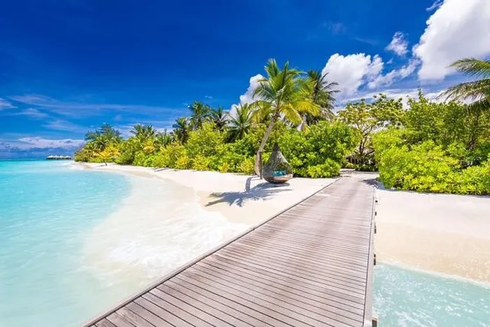 Framed Print : Beautiful tropical Maldives island with beach sea and coconut palm tree on blue sky for nature holiday vacation. Long jetty into paradise Framed Print : Beautiful tropical Maldives island with beach sea and coconut palm tree on blue sky for nature holiday vacation. Long jetty into paradise
