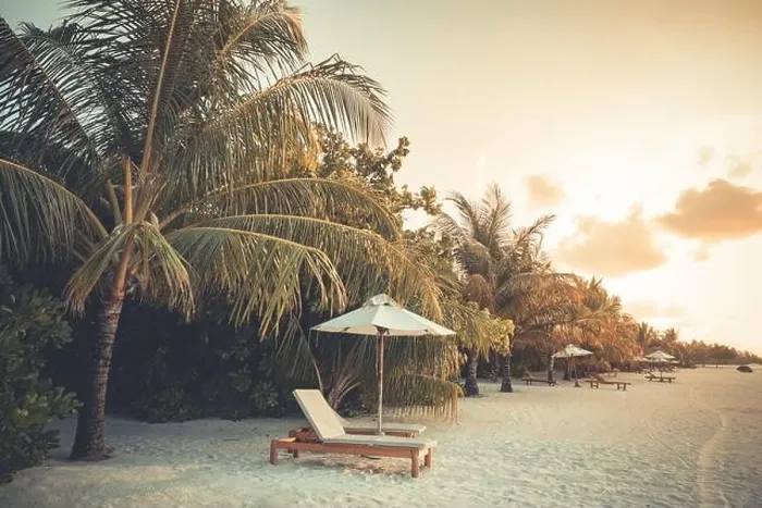 Framed Print : Beautiful tropical sunset scenery, two sun beds loungers umbrella palm tree. White sand, sea view with horizon, colorful twilight sky, beach resort Framed Print : Beautiful tropical sunset scenery, two sun beds loungers umbrella palm tree. White sand, sea view with horizon, colorful twilight sky, beach resort