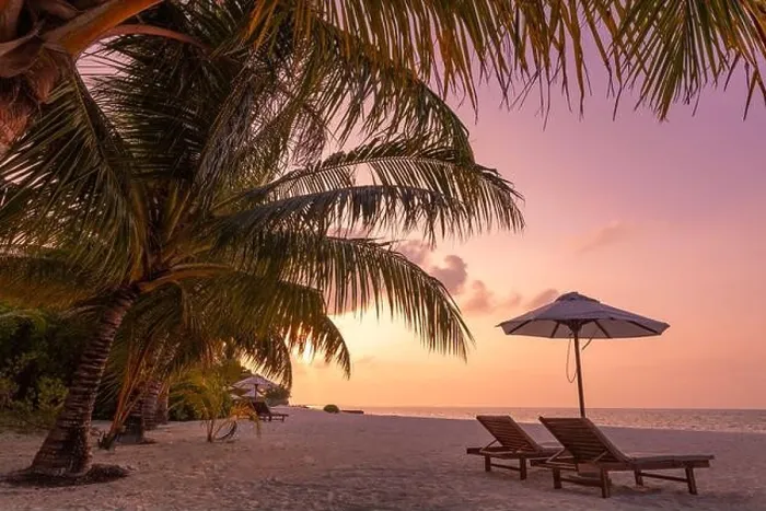Framed Print : Beautiful tropical sunset scenery, two sun beds loungers umbrella palm tree. White sand, sea view with horizon, colorful twilight sky, beach resort Framed Print : Beautiful tropical sunset scenery, two sun beds loungers umbrella palm tree. White sand, sea view with horizon, colorful twilight sky, beach resort