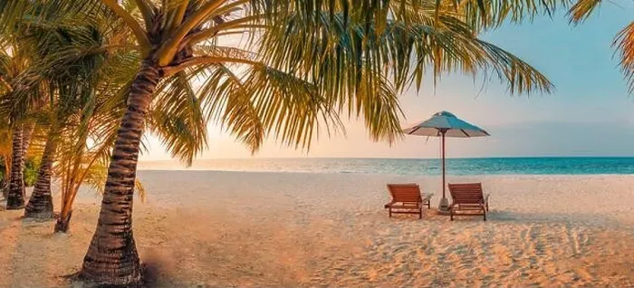 Framed Print : Beautiful tropical sunset scenery, two sun beds loungers umbrella palm tree. White sand, sea view with horizon, colorful twilight sky, beach resort