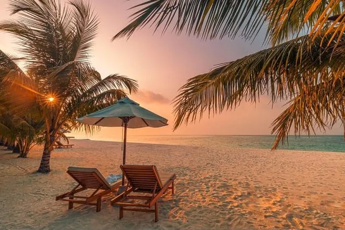 Framed Print : Beautiful tropical sunset scenery, two sun beds, loungers, umbrella under palm tree. White sand, sea view with horizon, colorful twilight sky calm Framed Print : Beautiful tropical sunset scenery, two sun beds, loungers, umbrella under palm tree. White sand, sea view with horizon, colorful twilight sky calm