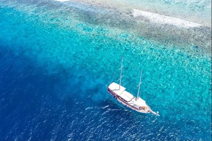 Framed Print : Beautiful turquoise ocean water boat top view aerial photo. Aerial view speed boat in the sea. Exotic sea lagoon, snorkel adventure, tropical ocean Framed Print : Beautiful turquoise ocean water boat top view aerial photo. Aerial view speed boat in the sea. Exotic sea lagoon, snorkel adventure, tropical ocean