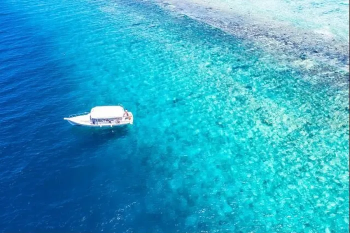 Framed Print : Beautiful turquoise ocean water boat top view aerial photo. Aerial view speed boat in the sea. Exotic sea lagoon, snorkel adventure, tropical ocean Framed Print : Beautiful turquoise ocean water boat top view aerial photo. Aerial view speed boat in the sea. Exotic sea lagoon, snorkel adventure, tropical ocean