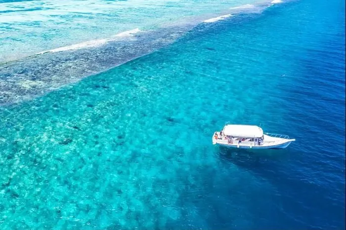 Framed Print : Beautiful turquoise ocean water boat top view aerial photo. Aerial view speed boat in the sea. Exotic sea lagoon, snorkel adventure, tropical ocean Framed Print : Beautiful turquoise ocean water boat top view aerial photo. Aerial view speed boat in the sea. Exotic sea lagoon, snorkel adventure, tropical ocean