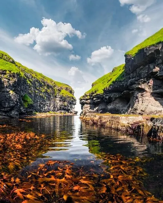 Framed Print : Beautiful view of dock or harbor with clear water and red seaweed in Gjogv village, Eysuroy island, Faroe Islands, Denmark. Landscape photography Framed Print : Beautiful view of dock or harbor with clear water and red seaweed in Gjogv village, Eysuroy island, Faroe Islands, Denmark. Landscape photography