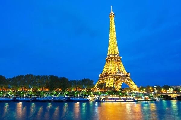 Beautiful view of illuminated Eiffel tower at dusk, Paris, France
