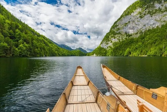 Framed Print : Beautiful view of traditional wooden rowing boat on scenic. Summer mountain lake pass scenic morning light at sunrise clouds over blue sky green trees
