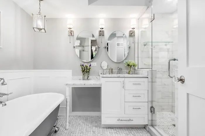 Framed Print : A beautiful white bathroom with a stand alone clawfoot bathtub with chrome hardware Framed Print : A beautiful white bathroom with a stand alone clawfoot bathtub with chrome hardware