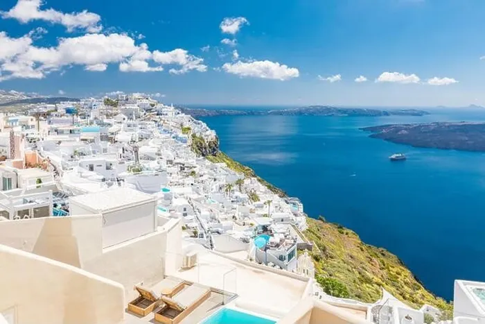 Framed Print : Beautiful white caldera view of Santorini in Greece. Luxury hotel resort pool over white architecture and sea view, blue sky. Summer travel vacation Framed Print : Beautiful white caldera view of Santorini in Greece. Luxury hotel resort pool over white architecture and sea view, blue sky. Summer travel vacation