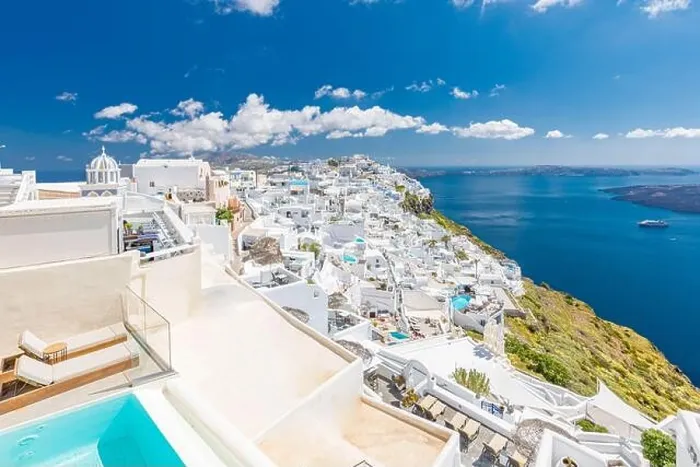Framed Print : Beautiful white caldera view of Santorini in Greece. Luxury hotel resort pool over white architecture and sea view, blue sky. Summer travel vacation Framed Print : Beautiful white caldera view of Santorini in Greece. Luxury hotel resort pool over white architecture and sea view, blue sky. Summer travel vacation