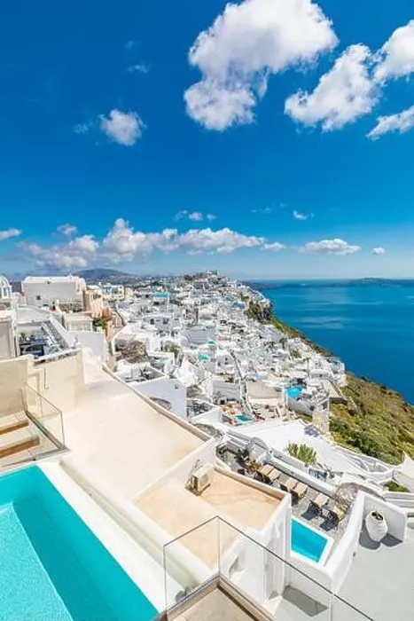 Framed Print : Beautiful white caldera view of Santorini in Greece. Luxury hotel resort pool over white architecture and sea view, blue sky. Summer travel vacation Framed Print : Beautiful white caldera view of Santorini in Greece. Luxury hotel resort pool over white architecture and sea view, blue sky. Summer travel vacation