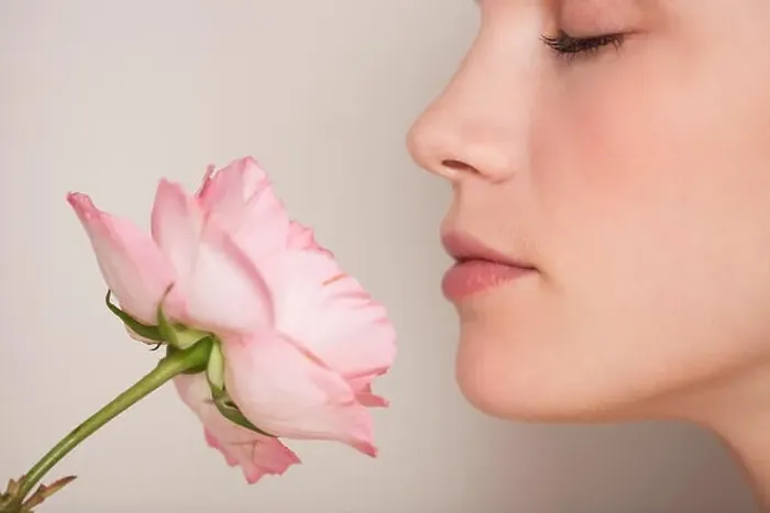 Framed Print : Beautiful woman smelling a flower Framed Print : Beautiful woman smelling a flower