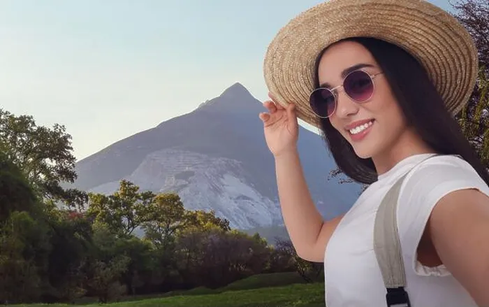 Framed Print : Beautiful woman in straw hat taking selfie in mountains Framed Print : Beautiful woman in straw hat taking selfie in mountains