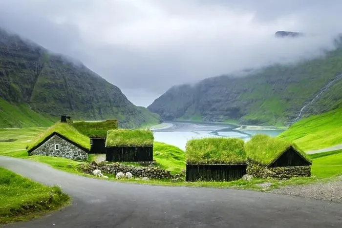 Framed Print : Beauty landscape with grassy houses and high mountains near famous church Saksunar Kirkja in Saksun village. Streymoy island, Faroe Islands, Denmark Framed Print : Beauty landscape with grassy houses and high mountains near famous church Saksunar Kirkja in Saksun village. Streymoy island, Faroe Islands, Denmark