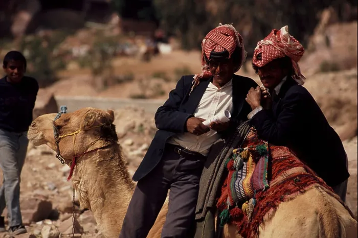 Framed Print : Two bedouin men offering camel rides in Petra Jordan Framed Print : Two bedouin men offering camel rides in Petra Jordan