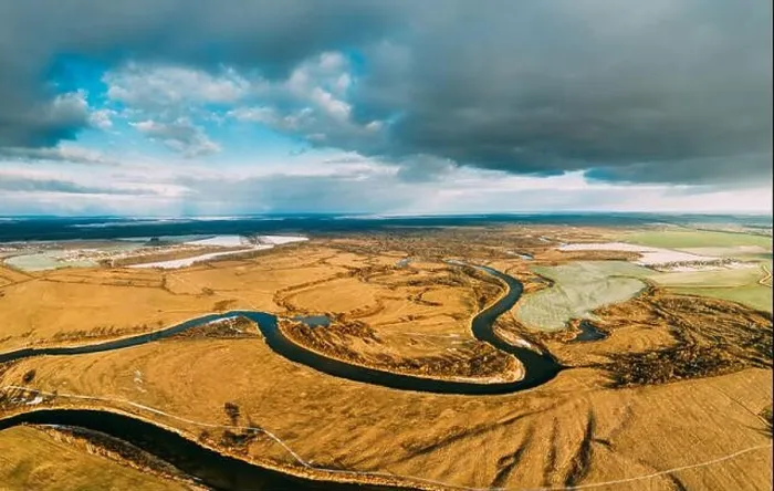 Framed Print : Belarus. Aerial View Of Dry Grass And Partly Frozen Curved River Landscape In Late Autumn Day. High Attitude View. Marsh Bog. Drone View. Bird's Eye V Framed Print : Belarus. Aerial View Of Dry Grass And Partly Frozen Curved River Landscape In Late Autumn Day. High Attitude View. Marsh Bog. Drone View. Bird's Eye V