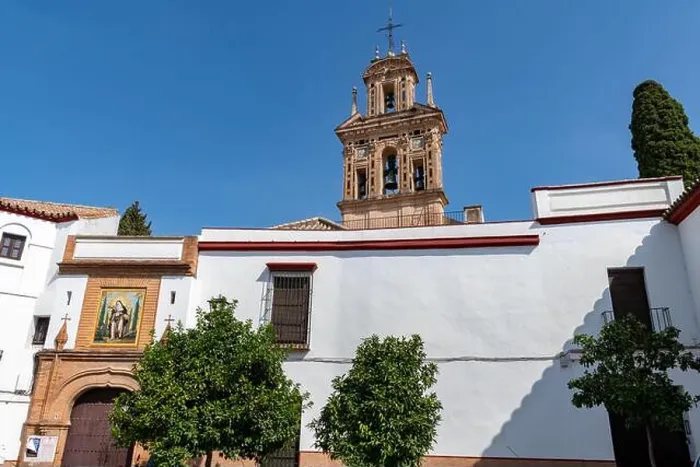 Framed Print : The belfry of the 15th century Monasterio de Santa Paula towers over the ornate façade of the convent on Calle Santa