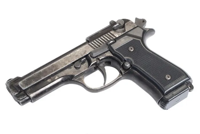 Framed Print : Beretta hand gun isolated on white background Framed Print : Beretta hand gun isolated on white background