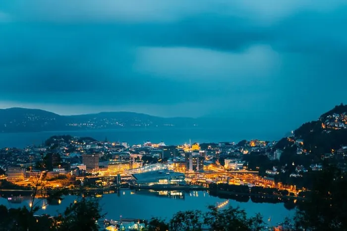 Framed Print : Bergen, Norway. Aerial View Cityscape Of Bergen And Harbor From Mountain Top In Blue Hour. City In Summer Evening Or Night Illuminations Lighting Framed Print : Bergen, Norway. Aerial View Cityscape Of Bergen And Harbor From Mountain Top In Blue Hour. City In Summer Evening Or Night Illuminations Lighting