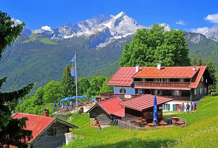 Framed Print : Berggasthof Eckbauer 1237m with sun terrace against the Alpspitze 2628m in the Wetterstein Mountains Framed Print : Berggasthof Eckbauer 1237m with sun terrace against the Alpspitze 2628m in the Wetterstein Mountains