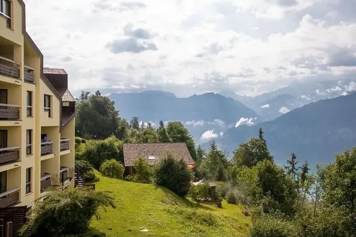 Framed Print : Bern, Switzerland - Jully 21, 2019:Landscape of Swiss Alps from Balkony, Beatenberg Switzerland Framed Print : Bern, Switzerland - Jully 21, 2019:Landscape of Swiss Alps from Balkony, Beatenberg Switzerland