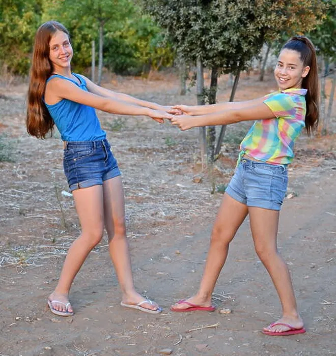 Framed Print : Best Friends Forever - two 12 year old teenage girls holding hands Framed Print : Best Friends Forever - two 12 year old teenage girls holding hands