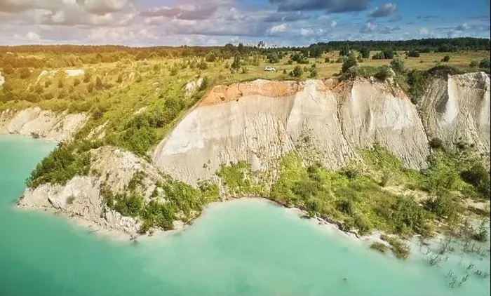 Framed Print : Big cliff to green quarry water aerial drone view Framed Print : Big cliff to green quarry water aerial drone view