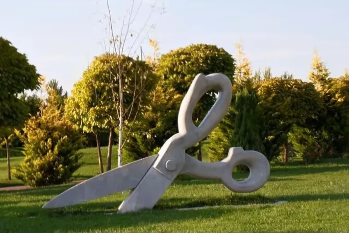 Framed Print : Big scissors in park on grass Framed Print : Big scissors in park on grass