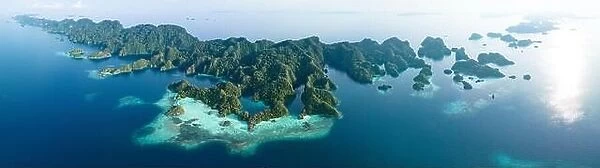 Biodiverse coral reefs surround the dramatic limestone islands that have been uplifted from Raja Ampat's beautiful, tropical seascape