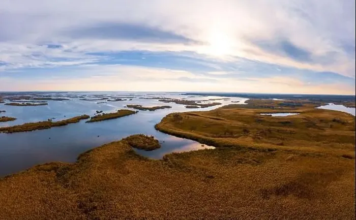 Framed Print : Bird's-eye view of the beautiful Samarskie Plavni in the warm evening light in Ukraine. Aerial panoramic drone shot Framed Print : Bird's-eye view of the beautiful Samarskie Plavni in the warm evening light in Ukraine. Aerial panoramic drone shot