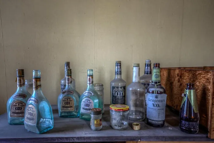 Framed Print : BIRMINGHAM, ALABAMA, USA: Empty bottles of spirits stand abandoned and forgotten Framed Print : BIRMINGHAM, ALABAMA, USA: Empty bottles of spirits stand abandoned and forgotten