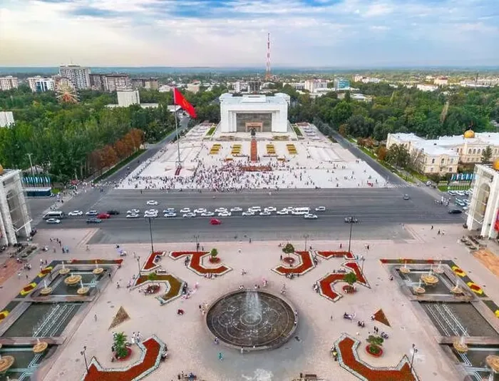 Framed Print : Bishkek, Kyrgyzstan - July 15, 2023: Aerial view of Bishkek city's Ala-Too central square with waving flag