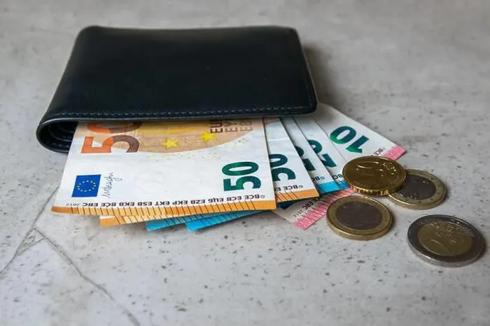 Framed Print : Black partmone with european money. Coins and bills in leather wallet for commerce concept Framed Print : Black partmone with european money. Coins and bills in leather wallet for commerce concept