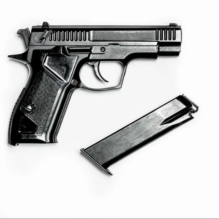 Framed Print : A black pistol with a magazine for cartridges lies on a white background Framed Print : A black pistol with a magazine for cartridges lies on a white background