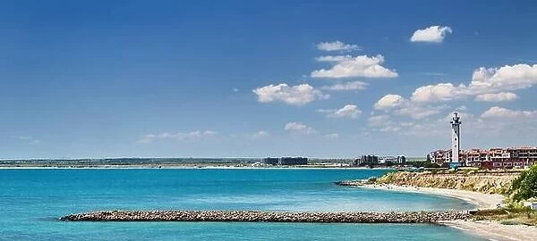 Black Sea coast of Bulgaria with sand beach, lighthouse and blue sky