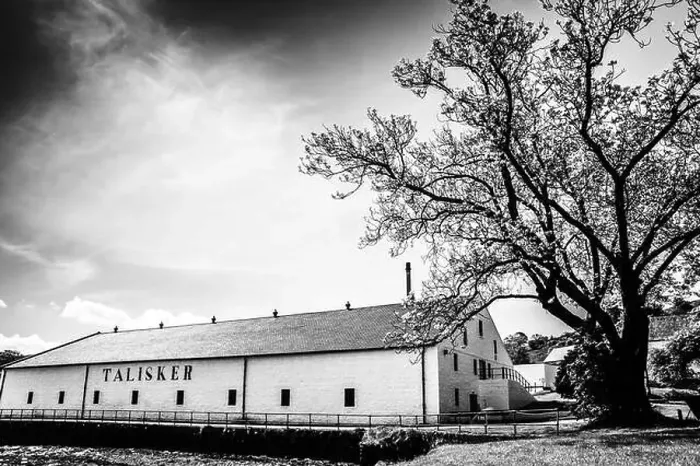 Framed Print : Black and white shot of the Talisker Distillery in the village of Carbost, Isle of Skye, Scotland Framed Print : Black and white shot of the Talisker Distillery in the village of Carbost, Isle of Skye, Scotland