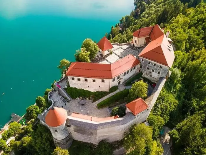 Framed Print : Bled Castle above Lake Bled in Slovenia in Summer. Aerial Drone View Framed Print : Bled Castle above Lake Bled in Slovenia in Summer. Aerial Drone View