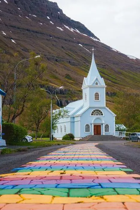 Framed Print : The Blue Church in Seydisfjordur with Multicolored Path and Mountain Backdrop Framed Print : The Blue Church in Seydisfjordur with Multicolored Path and Mountain Backdrop