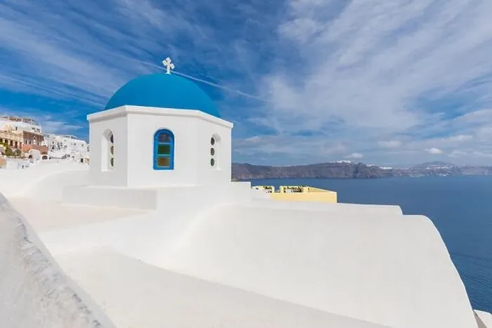 Framed Print : Blue dome in Santorini, Fira. Summer vacation landscape, peaceful sea view and volcanic cliff. Caldera view, cloudy sky Framed Print : Blue dome in Santorini, Fira. Summer vacation landscape, peaceful sea view and volcanic cliff. Caldera view, cloudy sky