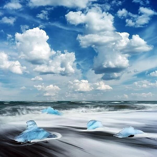 Blue Iceberg pieces on Diamond beach near Jokulsarlon lagoon, Iceland. Landscape photography