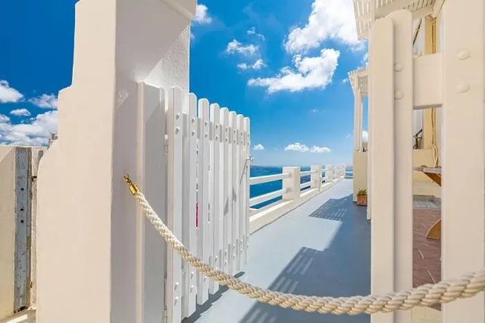 Framed Print : Blue sky with white gate and beautiful sea view. Amazing caldera with white architecture. Luxury summer travel and romantic vacation destination mood Framed Print : Blue sky with white gate and beautiful sea view. Amazing caldera with white architecture. Luxury summer travel and romantic vacation destination mood