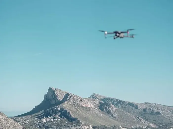 Framed Print : Blurred drone flying in cloudless blue sky over peaks of scenic mountain ridge near Pollensa town on sunny day in Framed Print : Blurred drone flying in cloudless blue sky over peaks of scenic mountain ridge near Pollensa town on sunny day in